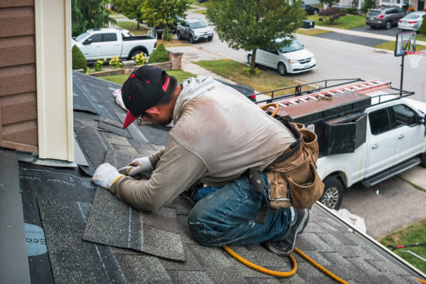 Professional Roofing technician working in Newtonville, MA